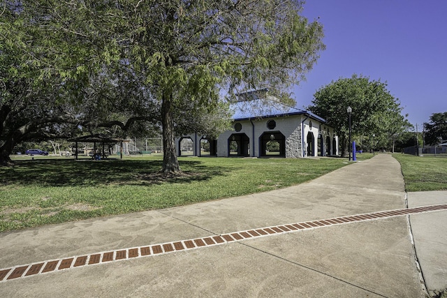 exterior space with a gazebo and a front lawn