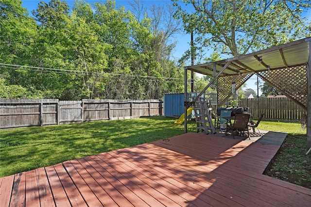 wooden terrace with a lawn