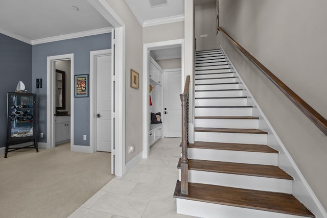 staircase with carpet flooring and ornamental molding