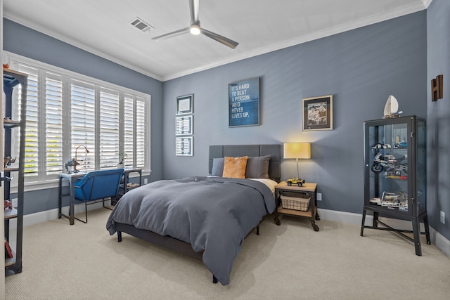 carpeted bedroom featuring ceiling fan and ornamental molding