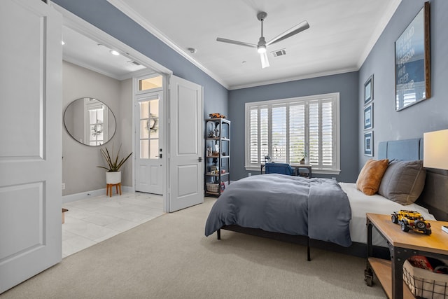 carpeted bedroom with ceiling fan and ornamental molding