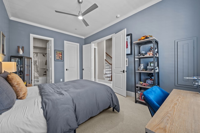 bedroom with ceiling fan, connected bathroom, ornamental molding, and light carpet