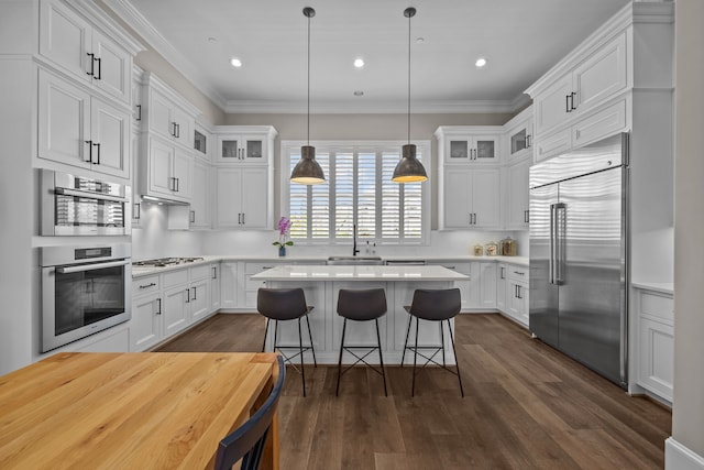 kitchen with white cabinetry and appliances with stainless steel finishes