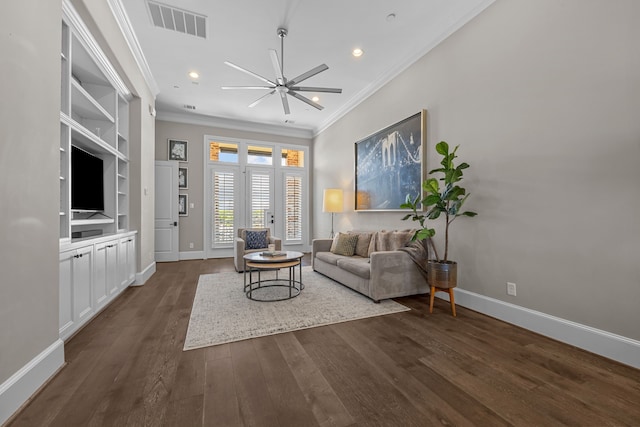 living room featuring ceiling fan, dark hardwood / wood-style floors, built in features, and ornamental molding