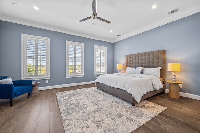 bedroom with crown molding, dark wood-type flooring, and ceiling fan