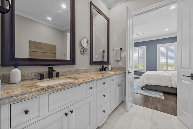 bathroom featuring vanity and ornamental molding