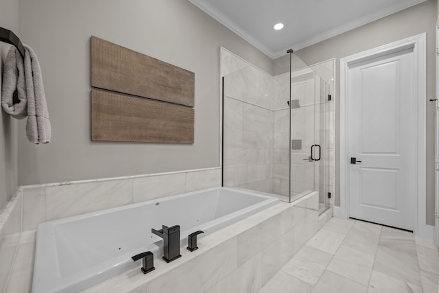 bathroom with crown molding and separate shower and tub