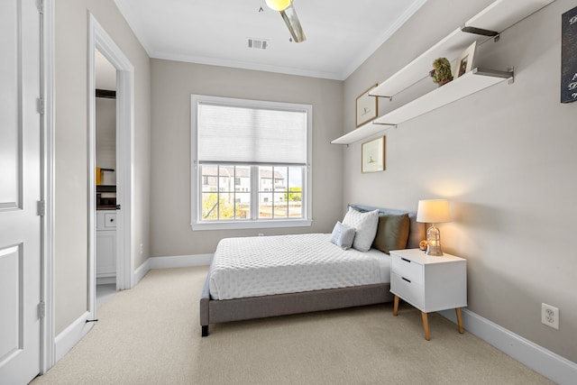 carpeted bedroom featuring ceiling fan and ornamental molding