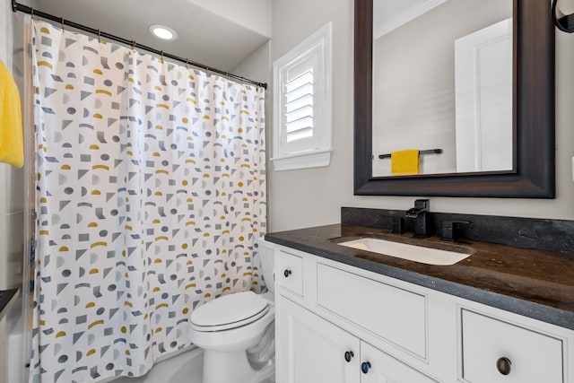 bathroom featuring vanity, toilet, and crown molding