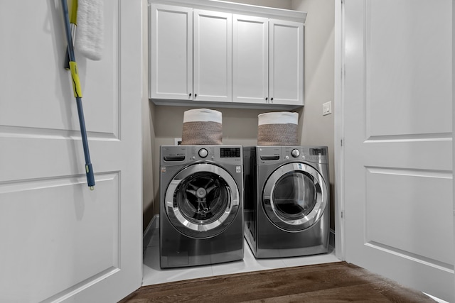 laundry area featuring cabinets and washer and dryer