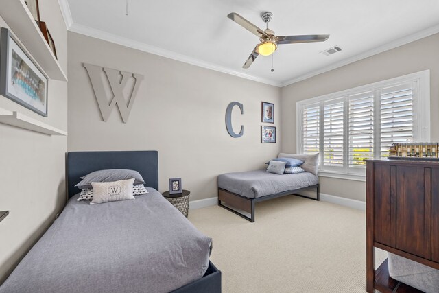 bedroom with crown molding, light colored carpet, and ceiling fan