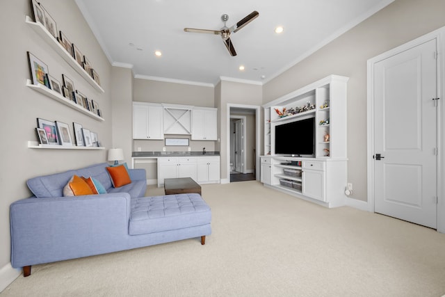 carpeted living room featuring crown molding and ceiling fan