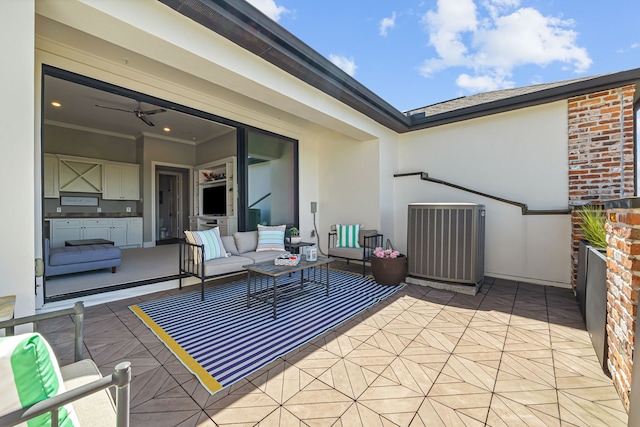 view of patio with an outdoor living space and central AC