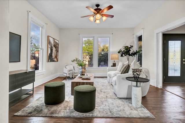 living room with ceiling fan and dark hardwood / wood-style floors