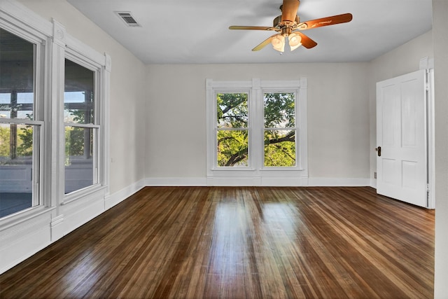 unfurnished room featuring dark hardwood / wood-style floors and ceiling fan