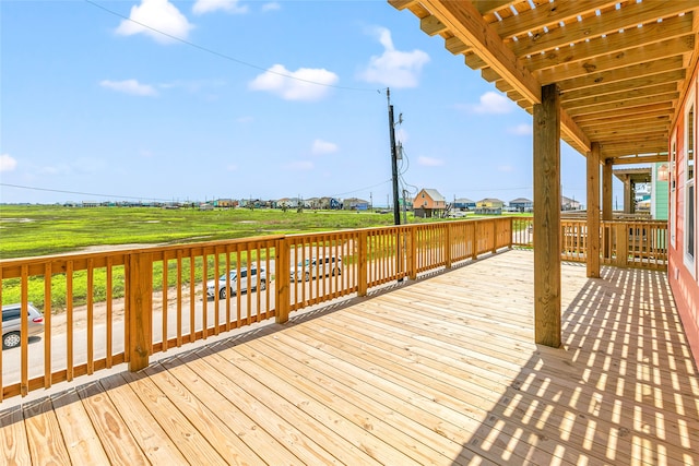 wooden deck featuring a yard