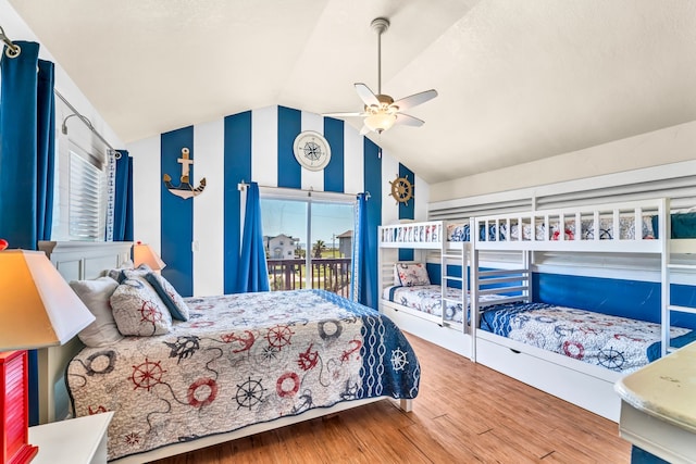 bedroom with lofted ceiling, ceiling fan, access to exterior, and wood-type flooring