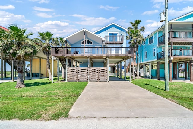 view of front of house featuring a balcony and a front yard