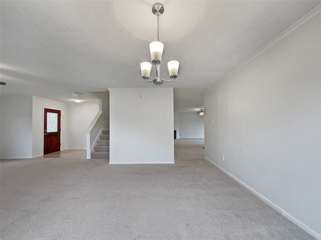 empty room featuring light colored carpet, ornamental molding, and ceiling fan with notable chandelier