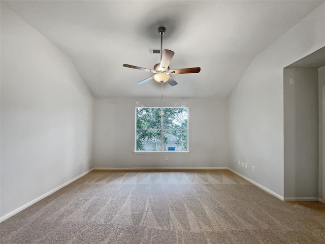 carpeted empty room with ceiling fan and lofted ceiling