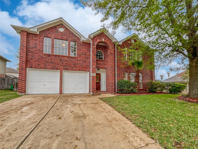 view of front of home with a front lawn and a garage