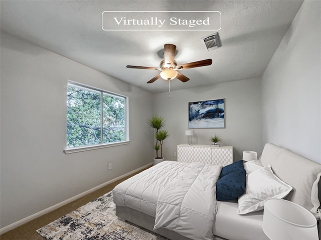 bedroom featuring ceiling fan and carpet floors