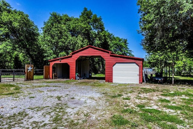 garage featuring a carport