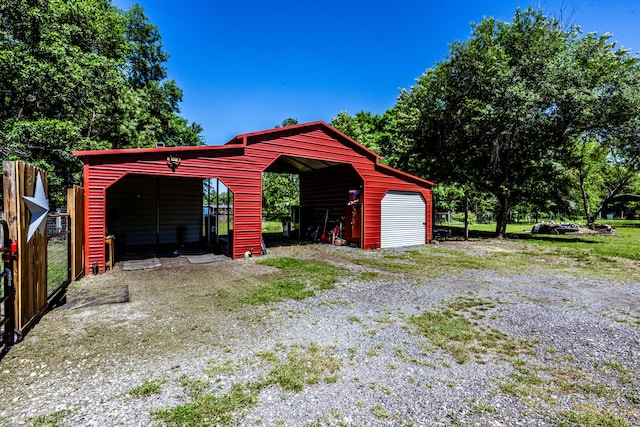 garage featuring a carport