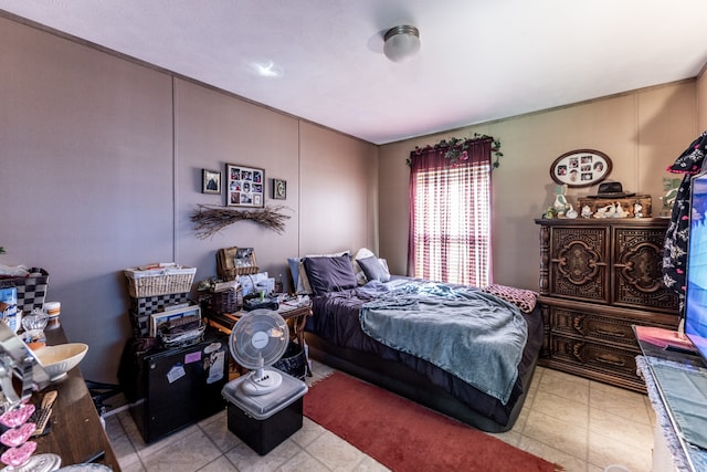 bedroom with light tile floors