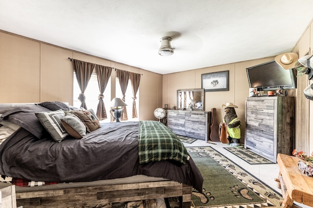 bedroom featuring tile flooring and ceiling fan