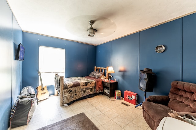 tiled bedroom with ceiling fan