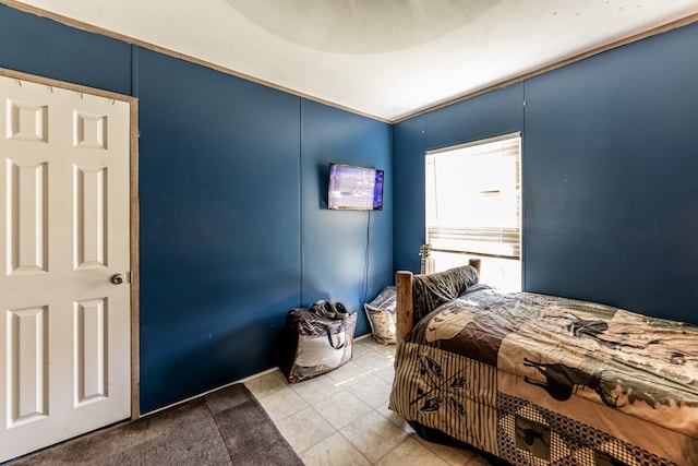 bedroom with light tile floors