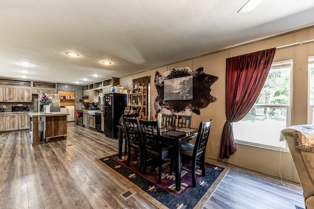 dining area featuring hardwood / wood-style floors