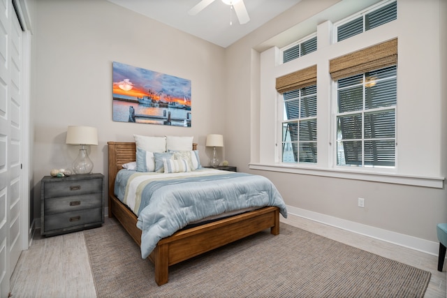 bedroom featuring light hardwood / wood-style flooring and ceiling fan