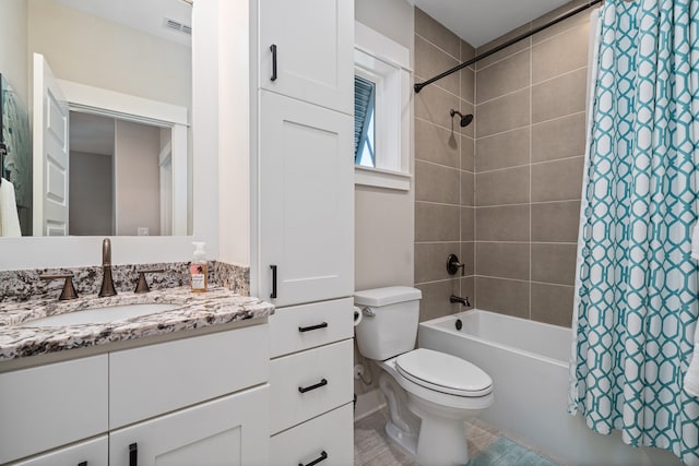 full bathroom with shower / tub combo, toilet, and vanity