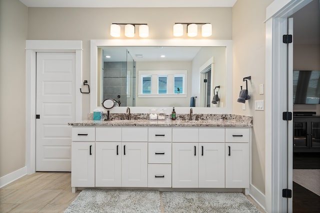 bathroom featuring tile flooring, double sink, and oversized vanity