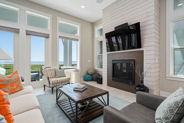 living room with a wealth of natural light and wood-type flooring