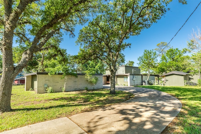 ranch-style home with a front lawn