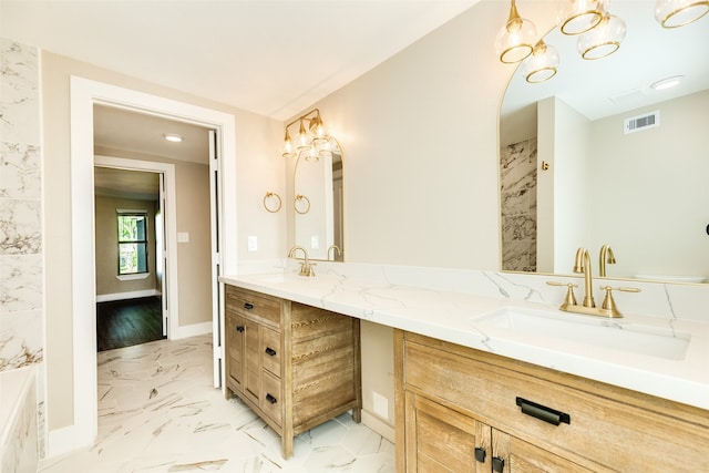 bathroom featuring tile flooring, double sink vanity, and a chandelier