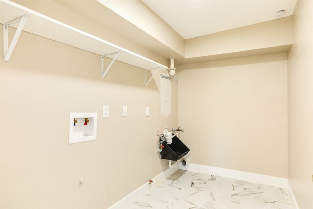 washroom featuring light tile flooring, washer hookup, and gas dryer hookup