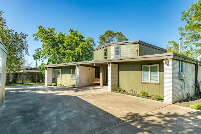 view of front of home with a carport