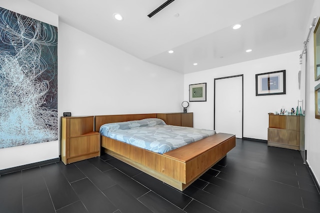 bedroom with dark wood-type flooring