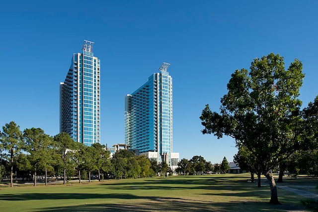 view of property's community with a lawn