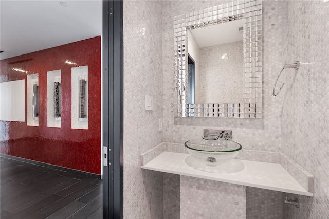 bathroom featuring tile walls and vanity