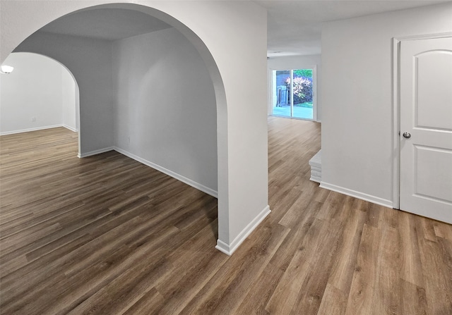 spare room with dark hardwood / wood-style floors