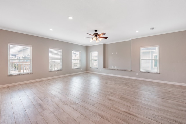 unfurnished room featuring ceiling fan, light hardwood / wood-style floors, and ornamental molding