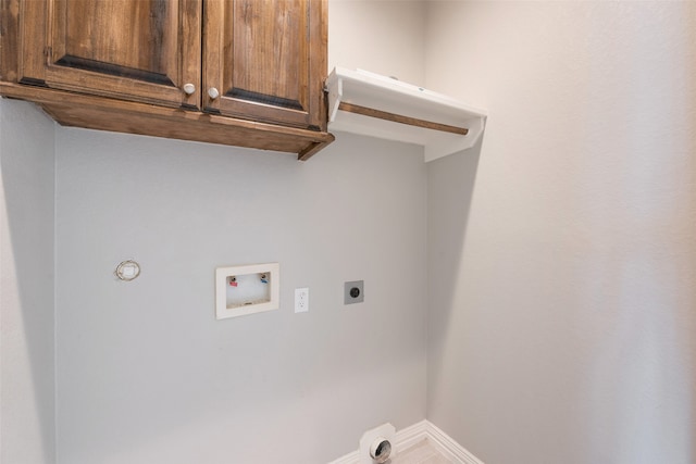 clothes washing area featuring washer hookup, electric dryer hookup, and cabinets