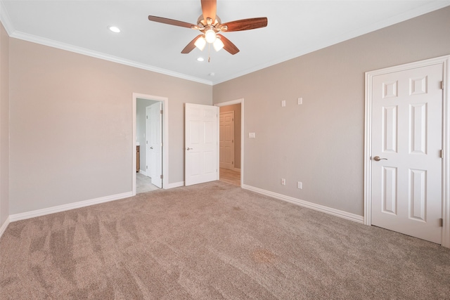 empty room featuring ornamental molding, light colored carpet, and ceiling fan