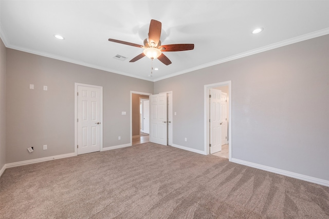 empty room with light carpet, ceiling fan, and crown molding