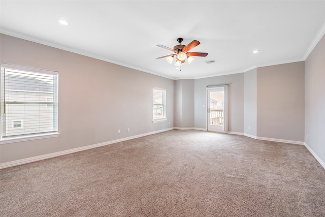 carpeted empty room with crown molding and ceiling fan